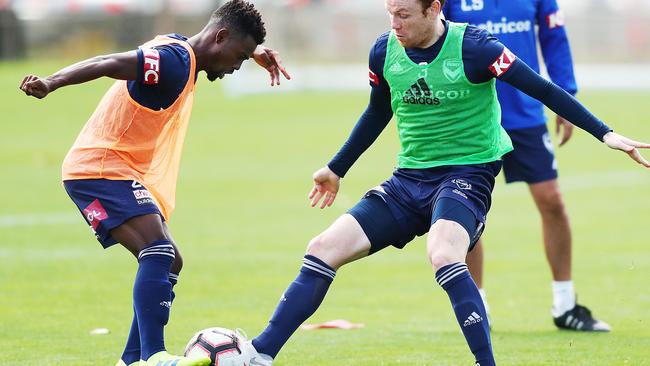 Elvis Kamsoba, left, competes for the ball against Corey Brown at Victory training this week. Picture: Getty Images