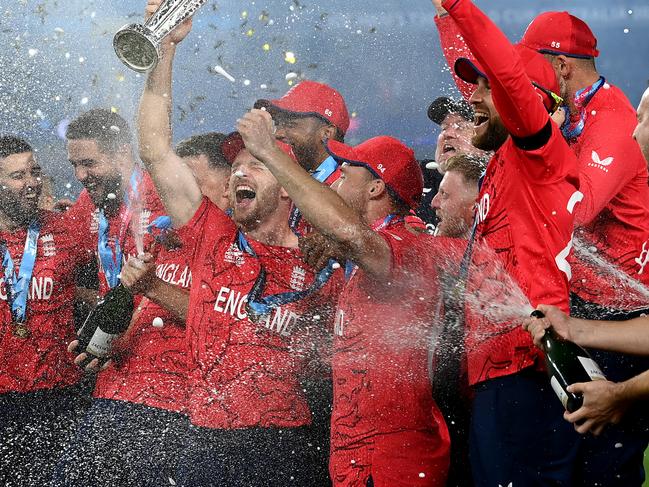 MELBOURNE, AUSTRALIA - NOVEMBER 13: England celebrate with the ICC Men's T20 World Cup Trophy after winning the ICC Men's T20 World Cup Final match between Pakistan and England at the Melbourne Cricket Ground on November 13, 2022 in Melbourne, Australia. (Photo by Quinn Rooney/Getty Images)