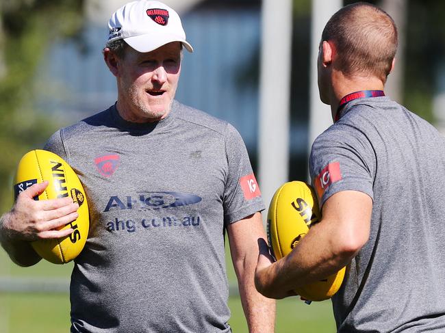 Melbourne training at Gosch's Paddock. Assistant coach Brendan McCartney talks with coach Simon Goodwin .Pic : Michael Klein