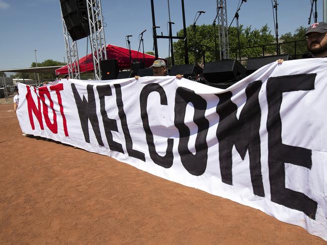 Demonstrators hold a banner to protest the visit ofUS President Donald Trump to the border city of El Paso, Texas. Picture: AP