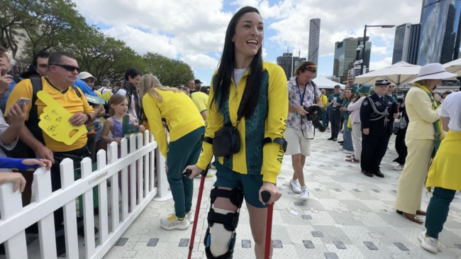 Michelle Jenneke on crutches at the Olympic welcome home parade in Brisbane.  Picture: Lucas Salvatori