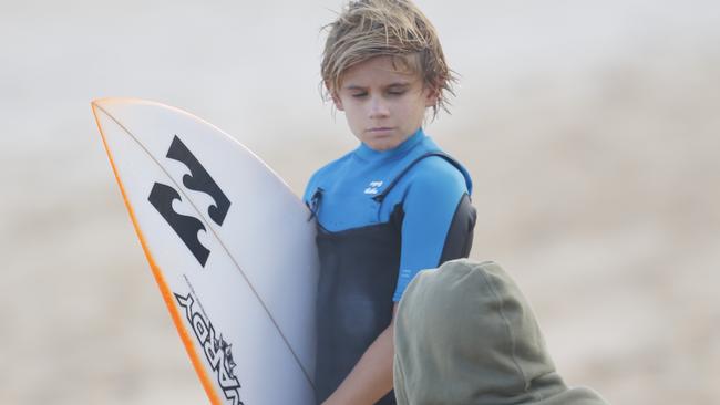 Ty Richardson getting coached by one of the best, Hid Dad Richo in Hawaii.photo by Mike Latronic Freesurf magazine.