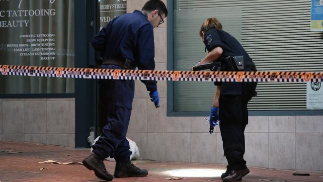 Forensic police at work at the crime scene. Picture: Damian Hoffman