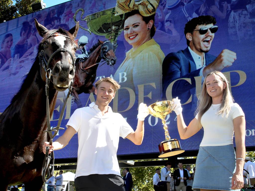 Adelaide Cup Barrier Draw on the Adelaide Oval Scoreboard. Local jockeys, Kayla Crowther and Ben Price  with former racehorse, ÂƒSoumahÂƒ. 8 March 2024. Pic. Dean Martin