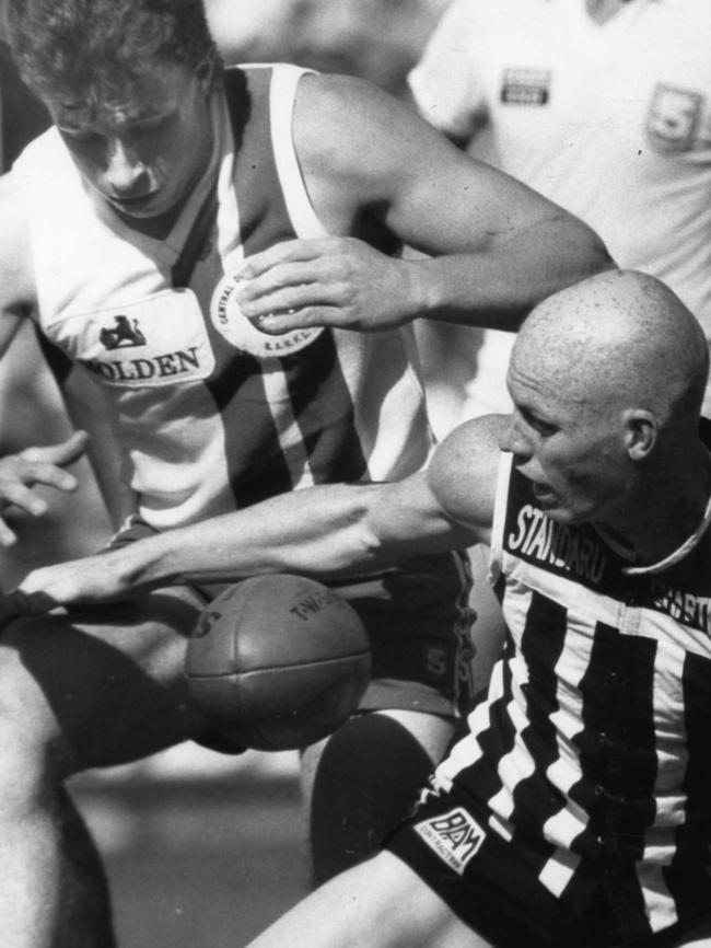 Roy Laird fights for the ball with Port Adelaide’s Rohan Smith in 1989.