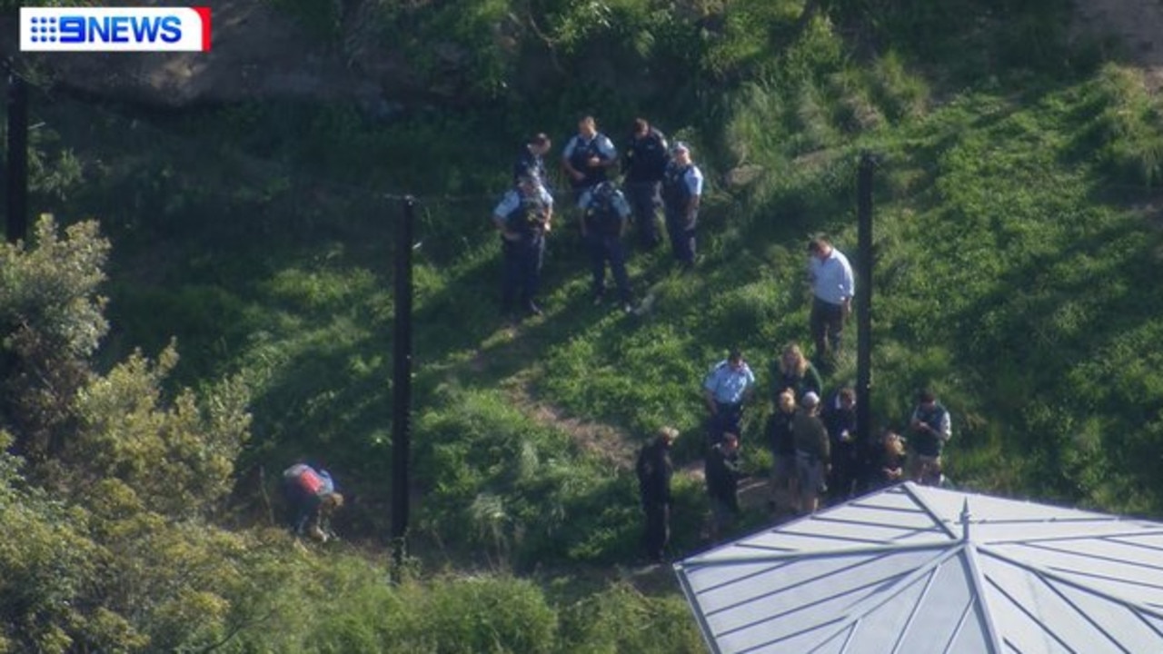 Police and zoo staff inspected the fence soon after the escape at Taronga Zoo.