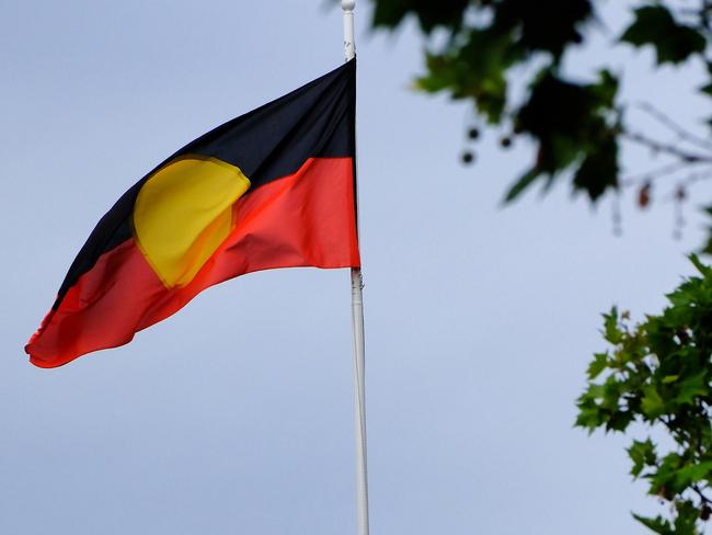 MELBOURNE, AUSTRALIA - NewsWire Photos JANUARY, 15, 2023: Th Aboriginal flag is seen at the Victorian Parliament building.Picture: NCA NewsWire / Luis Enrique Ascui
