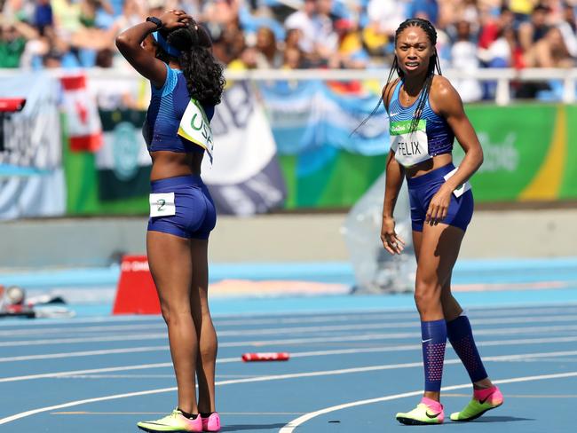 English Gardner (L) and Allyson Felix are dumbstruck after dropping the baton.