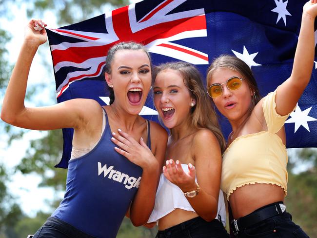 Friends Tahlia Rose James 16 from Hazelbrook, Abbi Loveday 14 from Emu Planes and Ayla Shields 15 from Wentworthville pose for photographs in Parramatta Park Australia Day. Parramatta, Friday, January 26th 2018. Celebrating Australia Day at the park. (AAP Image / Angelo Velardo)