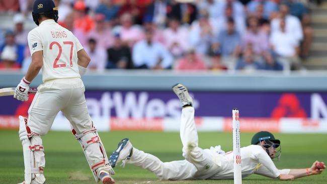 Cameron Bancroft dives to his left to catch out England batsman Rory Burns. Picture: Getty Images