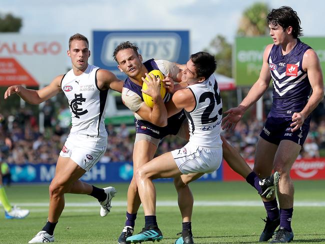 Zac Fisher of the Blues tackles James Aish of the Dockers  during the AFL Marsh Community Series pre-season match between the Fremantle Dockers and the Carlton Blues at David Grays Arena in Mandurah, Saturday, February 29, 2020. (AAP Image/Richard Wainwright) NO ARCHIVING, EDITORIAL USE ONLY