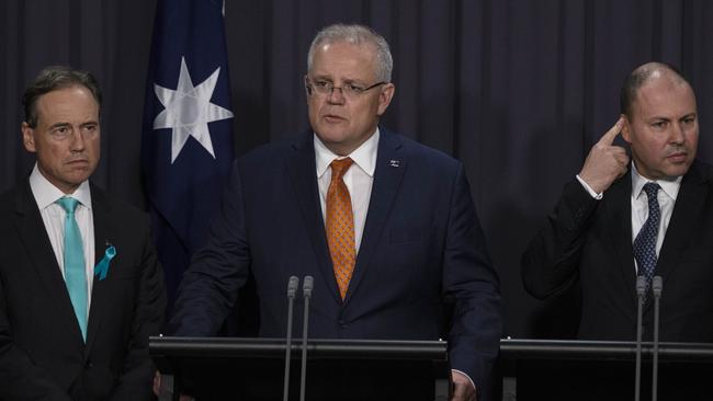 Prime Minister Scott Morrison with Health Minister Greg Hunt and Treasurer Josh Frydenberg. Picture: Gary Ramage