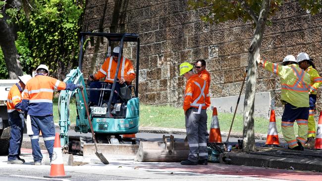 Ausgrid workers digging a hole on Oxford St, Paddington to make repairs after recent storms. Picture: Jonathan Ng