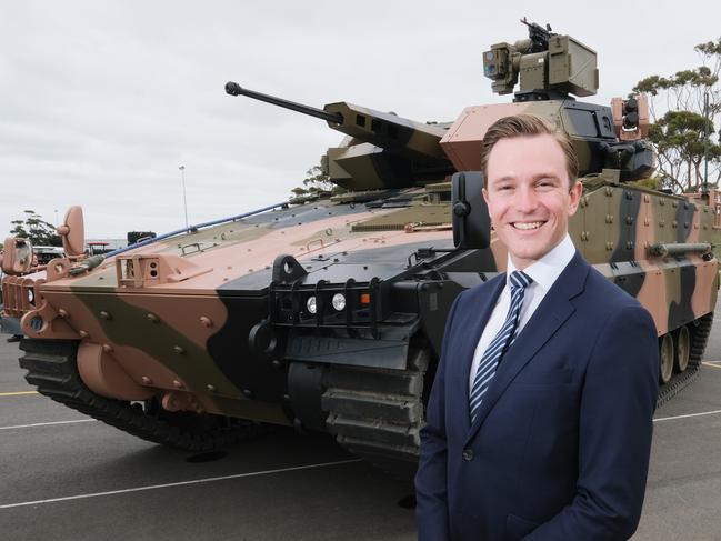 Geelong Council deputy mayor Cr Trent Sullivan with Hanwha Defence Australia’s Redback Infantry fighting vehicle. Picture: Mark Wilson