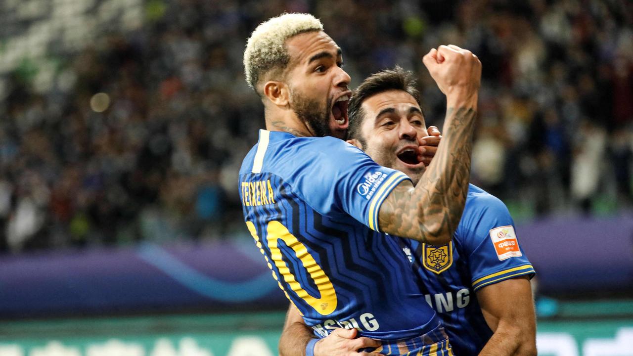 Jiangsu Suning's Alex Teixeira celebrates a goal in the team’s Chinese Super League final triumph last season. (Photo by STR / AFP)