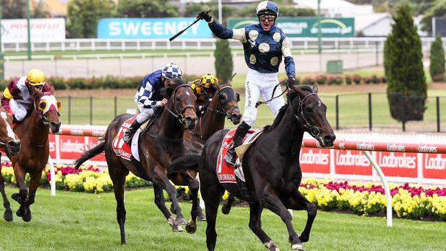 Jockey Glen Boss stands high in the irons as Sir Dragonet wins the 2020 Cox Plate.