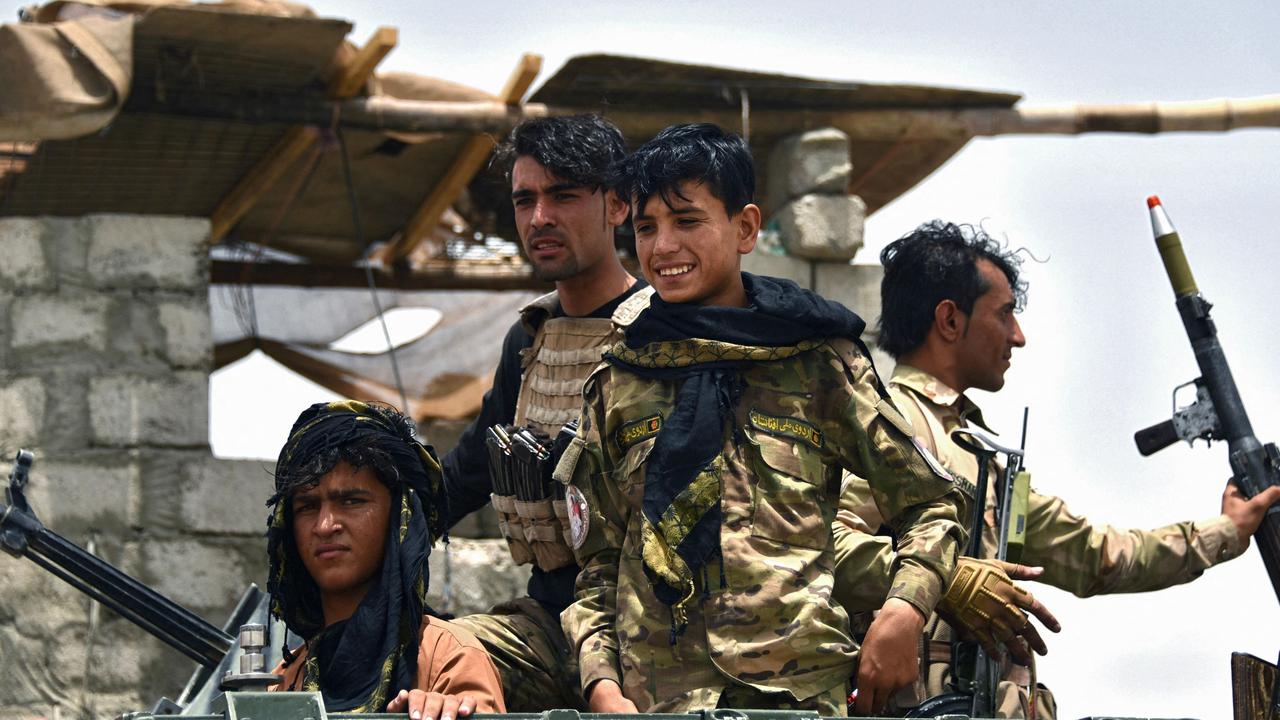 Afghan policemen sit on an armoured vehicle at a checkpoint in Panjwai district of Kandahar province on July 4, 2021. Picture: Javed Tanveer/AFP