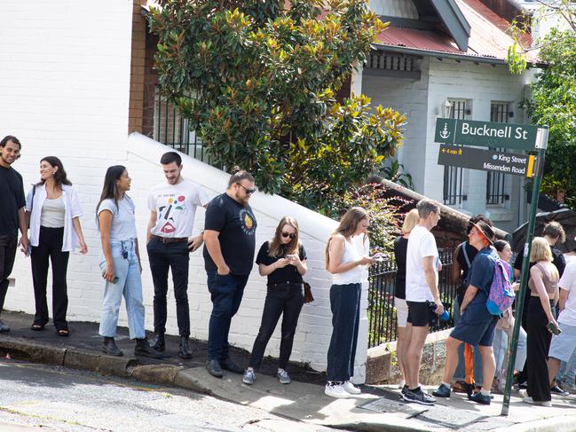 A  long line of people waiting to inspect rental accomodation, snakes around the block, in Newtown. There is a rental housing shortage many cities around Australia. Picture - Chris Pavlich for The Australian