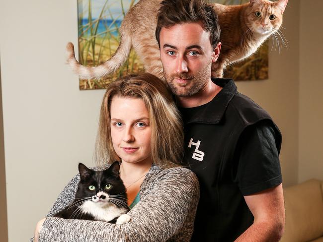 Jarryd and Sam have been reunited with their pet cats after a gang of burglars let them loose during a robbery. Picture: Tim Carrafa