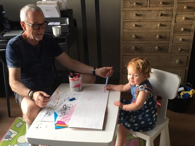 Professor McCallum and his granddaughter. Picture: Supplied