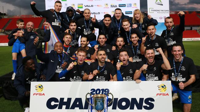 Adelaide Olympic celebrates its FFA Cup SA triumph — the club’s first major trophy — at Hindmarsh Stadium. Picture: AAP/Emma Brasier