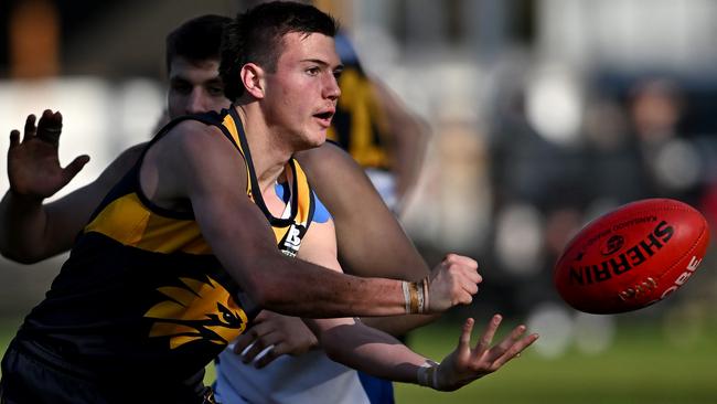 Blake Fitzgerald fires off a handball for Whittlesea. Picture: Andy Brownbill