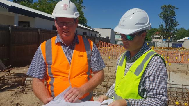 Rockhampton MP Barry O'Rourke and Paynters Project Manager Craig Hornagold looking over the plans for Rockhampton's social housing project.