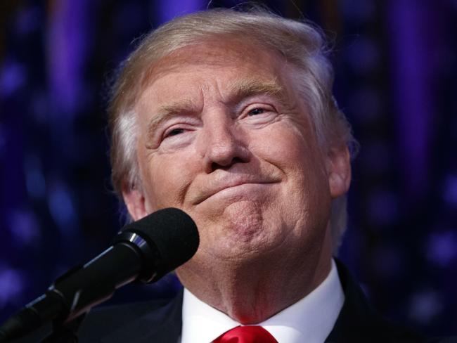 FILE - In this Nov. 9, 2016, file photo, President-elect Donald Trump smiles as he arrives to speak at an election night rally, Wednesday in New York. Donald Trump enters the White House on Jan. 20 just as he entered the race for president: defiant, unfiltered, unbound by tradition and utterly confident in his chosen course. In the 10 weeks since his surprise election as the nationâ€™s 45th president, Trump has violated decades of established diplomatic protocol, sent shockwaves through business boardrooms, tested long-standing ethics rules and continued his combative style of replying to any slight with a personal attack _ on Twitter and in person. (AP Photo/ Evan Vucci, File)