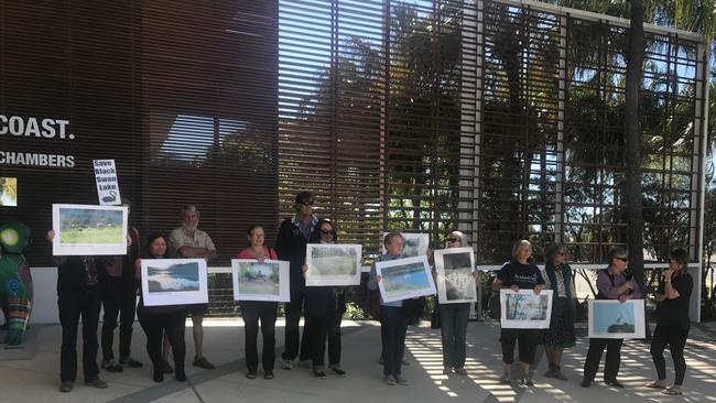 The Black Swan Lake protest group which remains outside city hall meetings. Photo: Lea Emery.