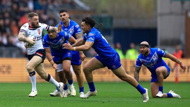 Daryl Clark of England breaks away while under pressure from Jeremiah Nanai of Samoa during the Autumn International Series test match between England and Samoa at Brick Community Stadium on October 27, 2024 in Wigan, England. (Photo by Jess Hornby/Getty Images)