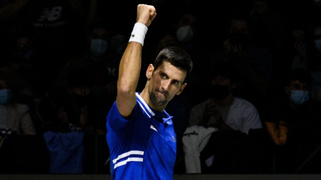 MADRID, SPAIN - DECEMBER 03: (EDITORIAL USE ONLY) Novak Djokovic of Serbia plays a backhand against Marin Cilic of Croatia during the Davis Cup Semi Final match between Croatia and Serbia at Madrid Arena pavilion on December 03, 2021 in Madrid, Spain. (Photo by Juan Naharro Gimenez/Getty Images for Lexus)