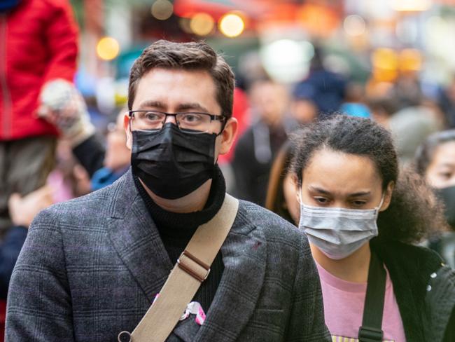 London, January 26, 2020. People wearing a face masks to protecting themself because of epidemic in China. Selective Focus. Concept of coronavirus quarantine. MERS-Cov, middle East respiratory syndrome coronavirus, Novel coronavirus 2019-nCoV.