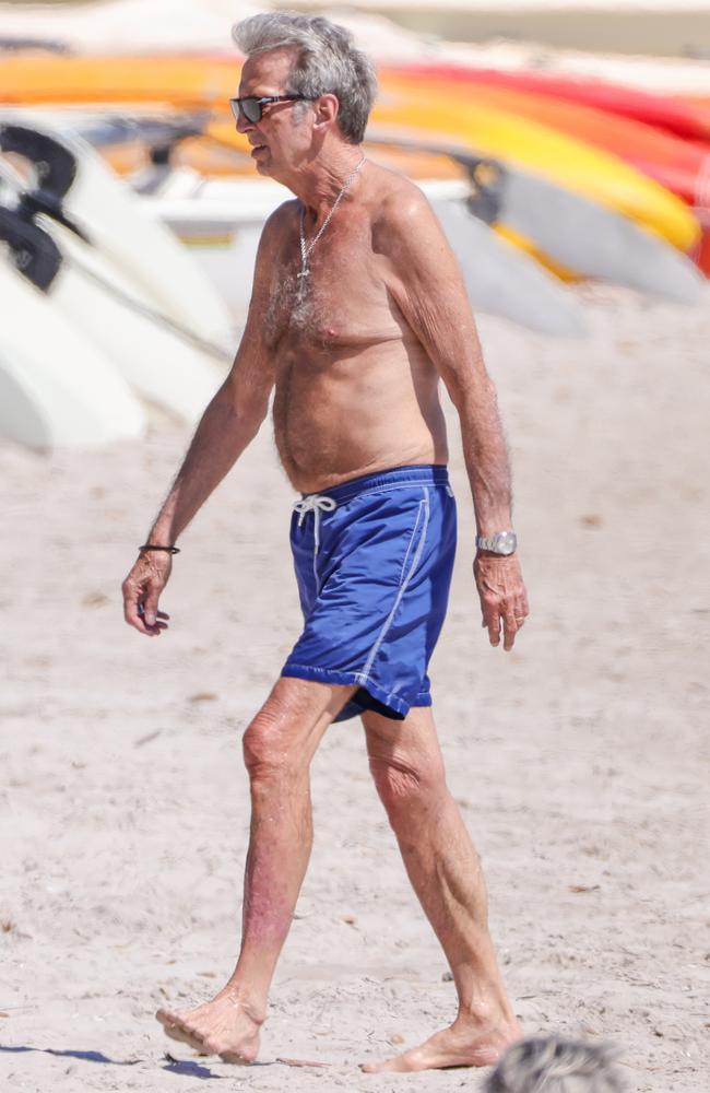 The legendary guitarist hit the beach to sunbathe, took a dip in the ocean, and enjoyed some time on a yacht. Picture: TheImageDirect.com