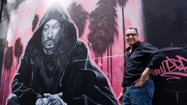 Treasury Wine Estates CEO Tim Ford next to a Snoop Dogg mural in Melbourne.