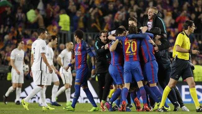 Barcelona players celebrate at the end of the match.