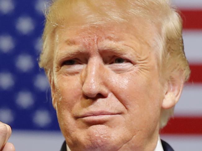 In this July 17, 2019, photo, President Donald Trump arrives to speak at a campaign rally at Williams Arena in Greenville, N.C. (AP Photo/Carolyn Kaster)