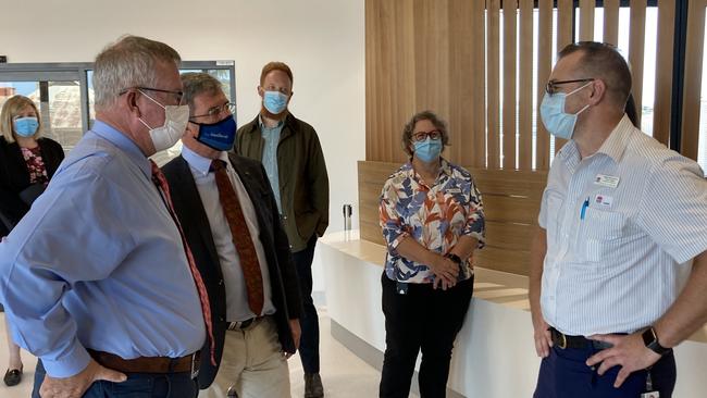 Dubbo's Western Cancer Centre nursing unit manager Tim Williams (right) discusses the services the centre provides with Parkes federal Nationals MP Mark Coulton (left) and Regional Health Minister David Gillespie. Picture: Ryan Young