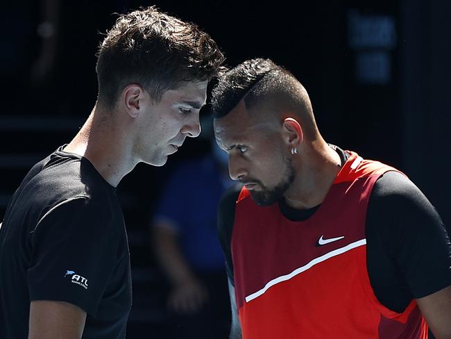 MELBOURNE, AUSTRALIA - JANUARY 27: Nick Kyrgios and Thanasi Kokkinakis of Australia discuss tactics in their Men's Doubles Semifinals match against Marcel Granollers of Spain and Horacio Zeballos of Argentina during day 11 of the 2022 Australian Open at Melbourne Park on January 27, 2022 in Melbourne, Australia. (Photo by Darrian Traynor/Getty Images)