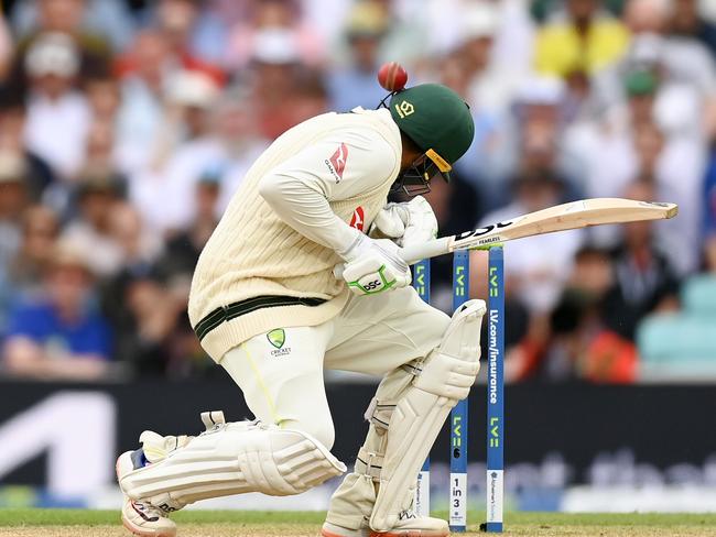 LONDON, ENGLAND - JULY 30: Usman Khawaja of Australia is hit on the helmet by a Mark Wood of England delivery during Day Four of the LV= Insurance Ashes 5th Test Match between England and Australia at The Kia Oval on July 30, 2023 in London, England. (Photo by Gareth Copley/Getty Images)