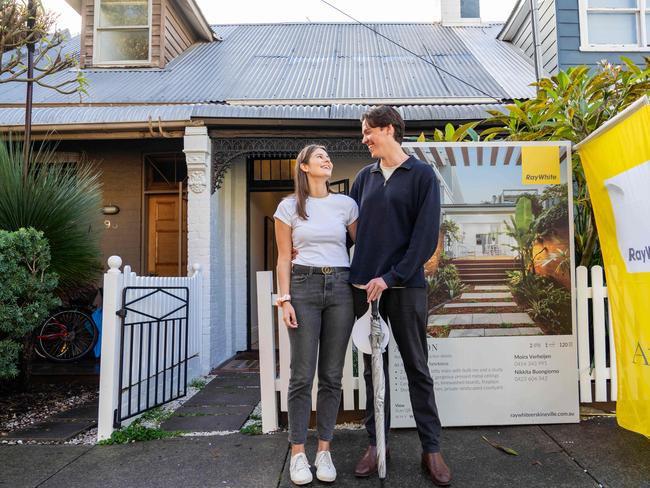 First home owners Dean Brockett and Emma Borkman after their successful bid in Newtown this morning.Picture: Tom Parrish