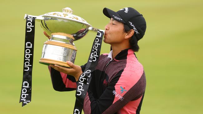 Min Woo Lee celebrates with the trophy after winning the Scottish Open. Picture: Andrew Redington/Getty Images