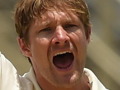 Australia's Shane Watson reacts on taking the wicket of West Indies' Jason Holder (R) on day four of the second cricket Test between Australia and the West Indies, June 14, 2015 at Sabina Park in Kingston, Jamaica. AFP PHOTO / ROBYN BECK