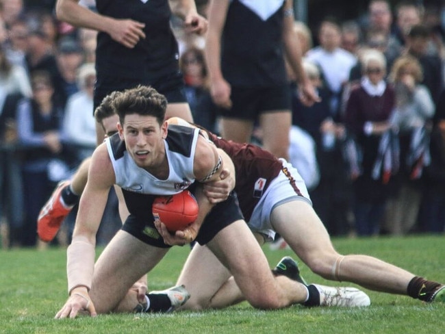 Trent Farmer is caught in a tackle in last year’s grand final. Picture: Davis Harrigan