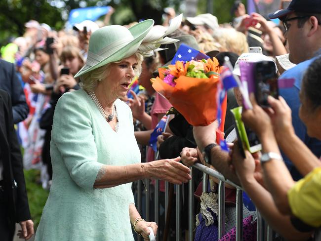 The Duchess of Cornwall receives flowers from a member of the public during a visit to Brisbane. Picture: Dan Peled/AAP