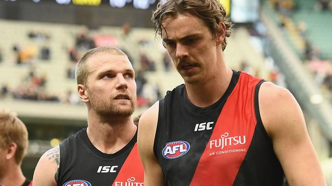 MELBOURNE, AUSTRALIA - MAY 05:  Jake Stringer and Joe Daniher of the Bombers look dejected after losing the round seven AFL match between the Essendon Bombers and the Hawthorn Hawks at Melbourne Cricket Ground on May 5, 2018 in Melbourne, Australia.  (Photo by Quinn Rooney/Getty Images)