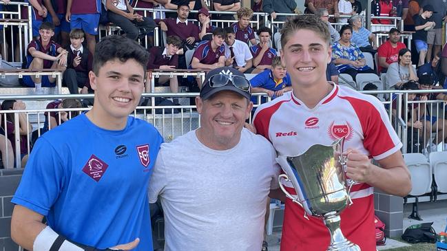 Palm Beach Currumbin players Marley McLaren and Taj lateo with Broncos legend Kevin Walters after the school won the Walters Cup.