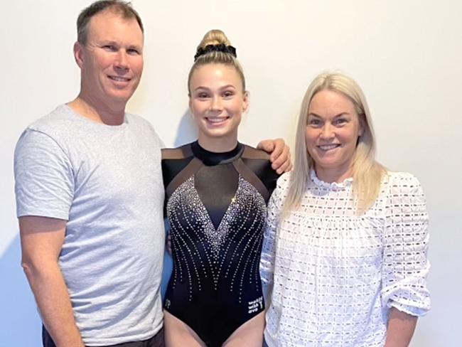 Olympic gymnast Ruby Pass (centre) with her father Chris and mother Regina. Picture: Supplied