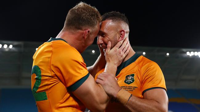 Reece Hodge congratulates Cooper after his stunning kick gave the Wallabies a remarkable victory. Picture: Getty Images