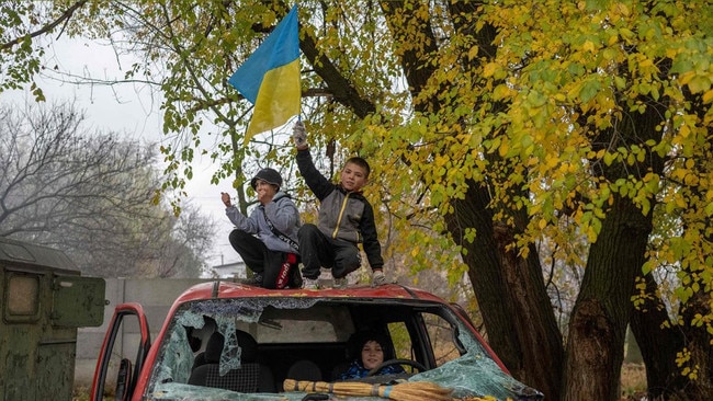 A boy at a former Russian checkpoint as locals celebrated the city’s liberation 12 days ago. Picture: AFP/Getty Images/The Times