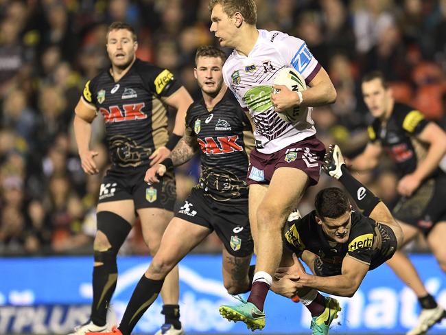 SYDNEY, AUSTRALIA - SEPTEMBER 04: Tom Trbojevic of Manly is tackled during the round 26 NRL match between the Penrith Panthers and the Manly Sea Eagles at Pepper Stadium on September 4, 2016 in Sydney, Australia. (Photo by Brett Hemmings/Getty Images)